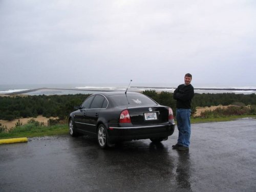 Antonette taking a picture of me and her car at the lighthouse parking lot.
