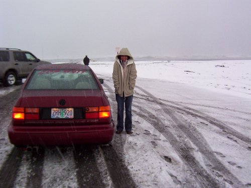 It's now 2004 and we're headed home.  Here's some snow on the beach (Washington)!
