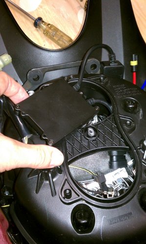 This is how you begin to stuff the electronics into the headlight bucket.  Follow along...

