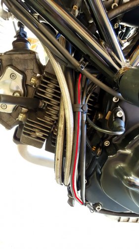 The red line shows the Motolectric cable going down the left side of the engine and then under the horizontal cylinder.
