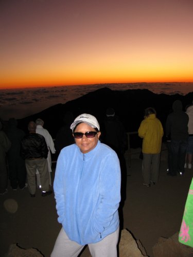 Day 6
Our very, very early morning climaxed atop Haleakala crater at 10,000 feet with a brisk 50-degrees temp.  We watched the sun rise and kind of got a double sun rise as the sun rose from the horizon under a break in the clouds as well as over the clouds.
