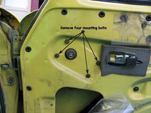 Remove window crank, door handle release trim (escutcheon), door card (panel) and remove vapor barrier.  Remove the four shown bolts with a 10mm wrench.
