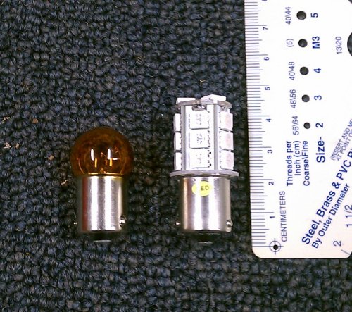 Size comparison of the incandescent (left) bulb vs. the LED unit (right).  Though the LED unit is taller it will still fit inside the signal housing with room to spare.
