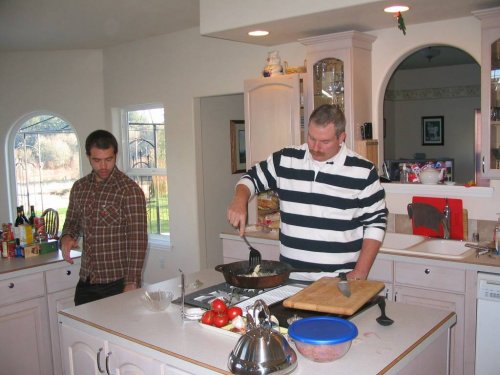 Alex supervising Steve's spaghetti sauce making.
