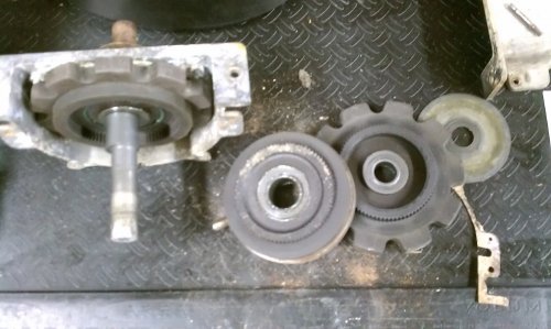Left to right:  Rear of gear box with rearward ring, laying on table is planetary ring, behind that is the forward ring, and behind that is a thin plastic washer.
