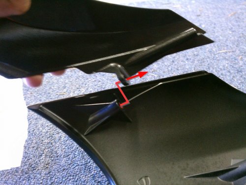 Shows how the top and bottom parts of the headlight fairing join.

