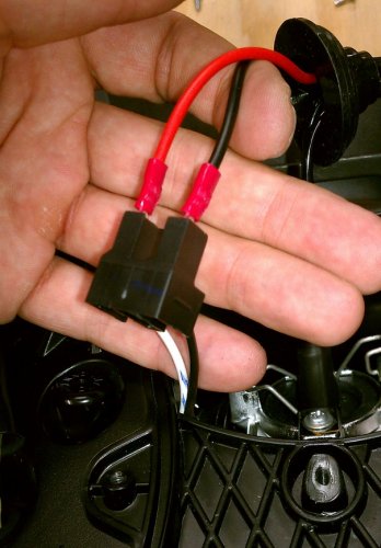 Push in the power supply spade connectors into the headlight connector.  As can be seen in the picture, I put the black wires together and the red wire with the white wire.
