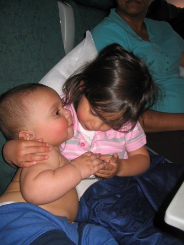 Bella entertaining Ronin.  It was a tough flight home:  All of us were tired and Bella was really acting up :-(
