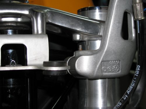 This shows the stock locating pin on the hi-riser.  Because the banjo fittings on the hand controls interfered with the gauge cluster I couldn't use the stock positions -- bummer!  So I removed the locating pins and rotated the clip-ons backward a couple millimeters.  My clip-ons are butted up against the upper triple.  I also had to adjust my left steering stop so my horn button wouldn't press against the tank so my left turning radius is slightly less than my right.
