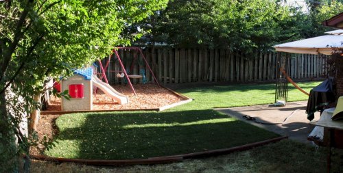 Panoramic from the side yard, looking at the kids play area.
