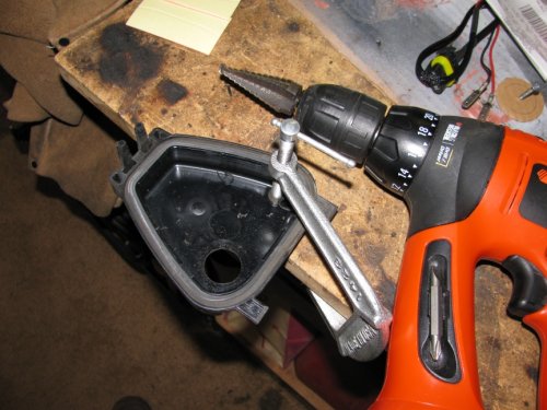 ...use a hole saw or reamer to enlarge to 7/8" diameter.  This is where the gasket will mount and allow the wires to pass through.
