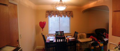 After: Panoramic view (stitched) of the dining room and archway into the living room.
