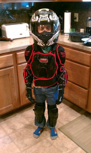 Bilt Helmet, Fly Racing Youth Barricade Long Sleeve Body Armor Suit (really just an armored mesh jacket), Bilt gloves, and Alpinestars knee & shin armor.
