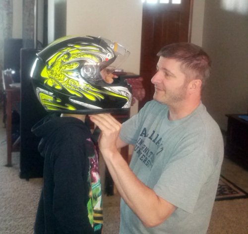 Test fitting the youth Bilt helmet.  Ronin chose this himself, a black with Day-Glo Yellow...it's even brighter in person!
