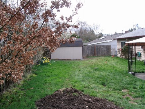 Finished.  View from compost pile.  BTW, the dirt you see is from the site excavation.

