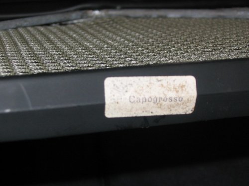 "Capogrosso" sticker on the front metal trim of the parcel tray.
