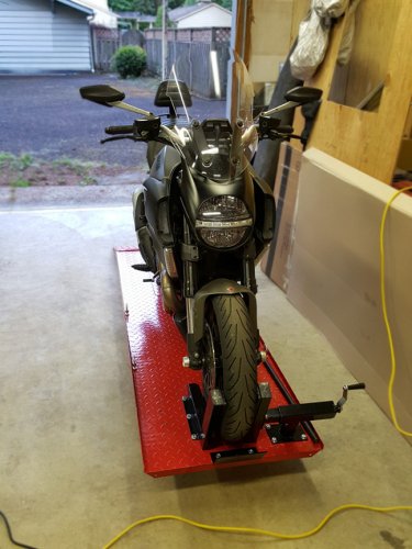 My Diavel Strada (cruiser-ish) clamped in without straps.

