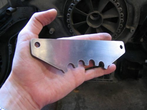 My new design easily fits in your hand.  It's 1/4" steel, cut with a wire EDM for precise radiusing of the pulley lock teeth, and ground flat.
