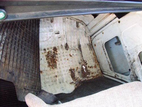 Right side footwell has some rust-through.
